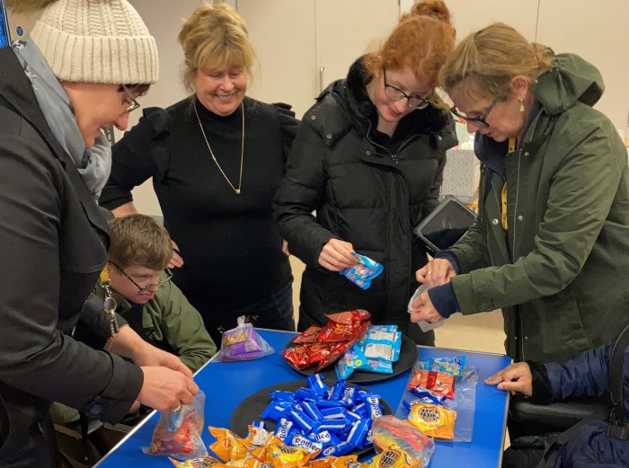 Oaklands pupils helping to make children's snack bags at the foodbank.