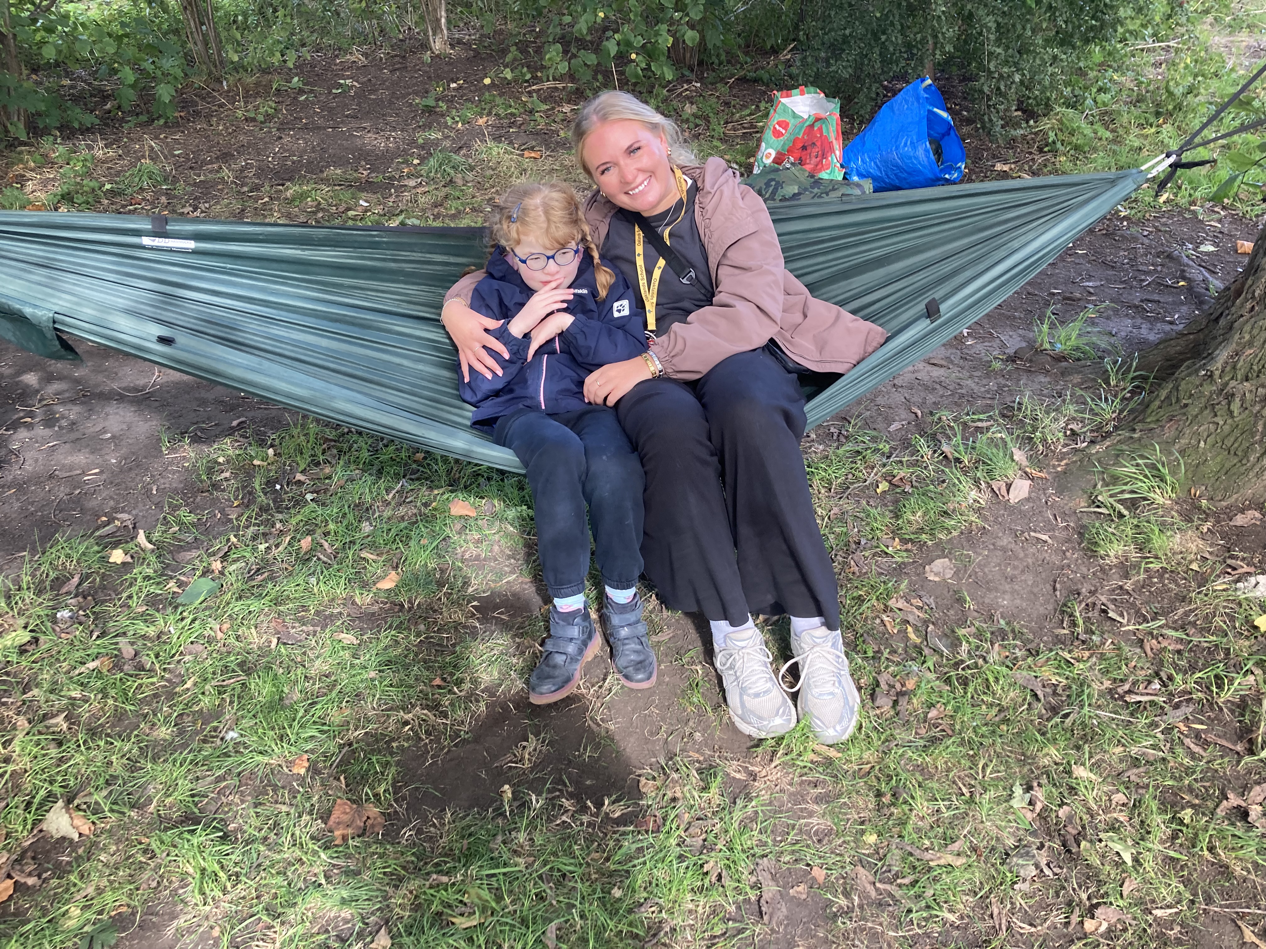 Pupil and staff on hammock